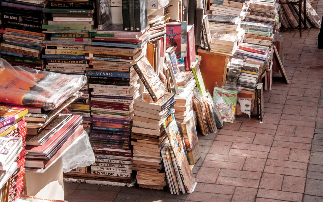 Books are stacked for sale at a secondhand book market in Türkiye, undated. (Adobe Stock Photo)