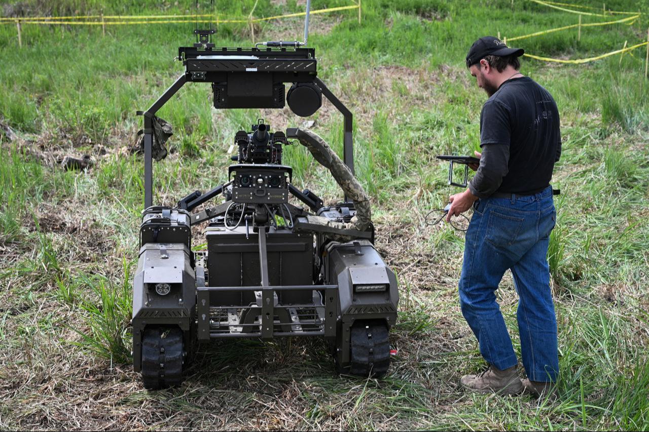 A man pilots an unmanned ground vehicle (UGV) during the “Wild Drones” racing competition in Truskavets, Lviv region, on May 20, 2026. (AFP Photo)