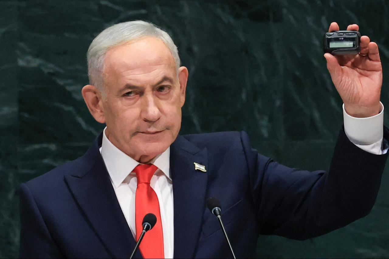 Israel's Prime Minister Benjamin Netanyahu holds up a pager as he speaks during the 81st United Nations General Assembly at the United Nations Headquarters in New York, Sept. 24, 2026. (AFP Photo)