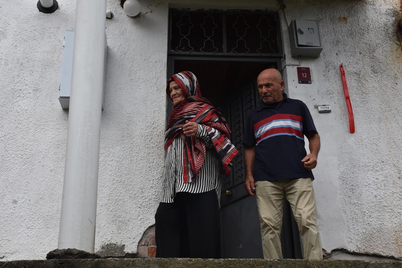 Hatice Akbas and her husband Ali Akbas stand outside their home in Trabzon after returning from a trip to Saudi Arabia and Egypt prompted by her appearance in Trabzonspor's Mohamed Salah transfer video. (AA Photo)