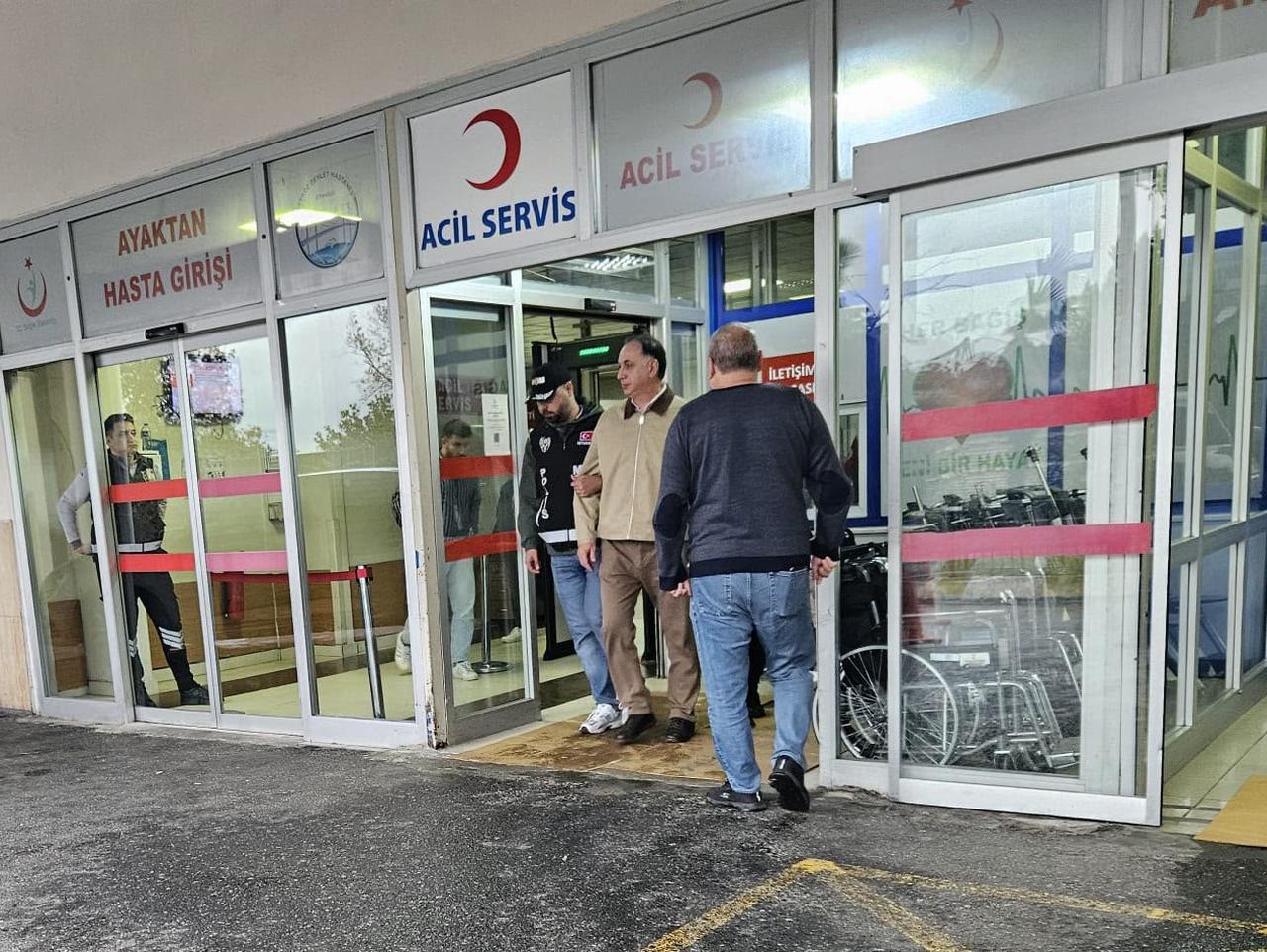 Ferhat Gundogdu, head of the Turkish Football Federation's Central Refereeing Committee, is escorted out of an emergency department following a police operation targeting figures in Türkiye's football refereeing system in Istanbul, Türkiye, Sept. 29, 2026. (IHA Photo)