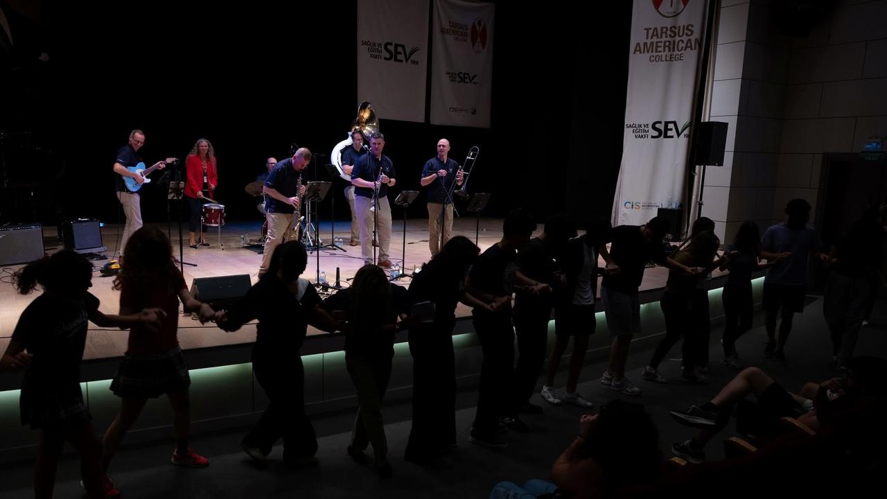 Students dance in front of the stage as the U.S. Air Forces in Europe Band performs at Tarsus American College in southern Türkiye. (IHA Photo)