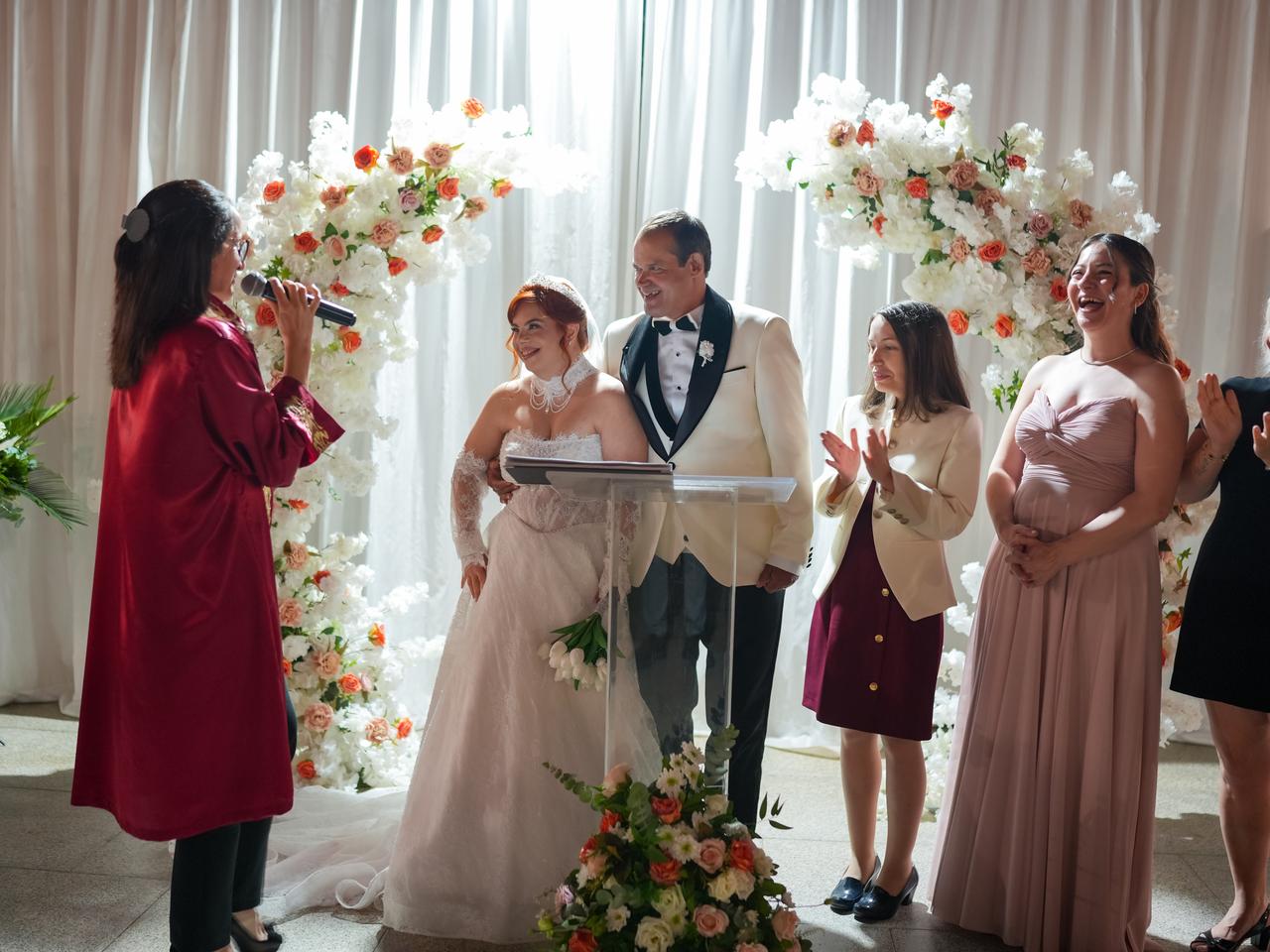Family and guests applaud Betim Ercayan Terzi and Fikri Terzi at their wedding ceremony in Izmir.(AA Photo)