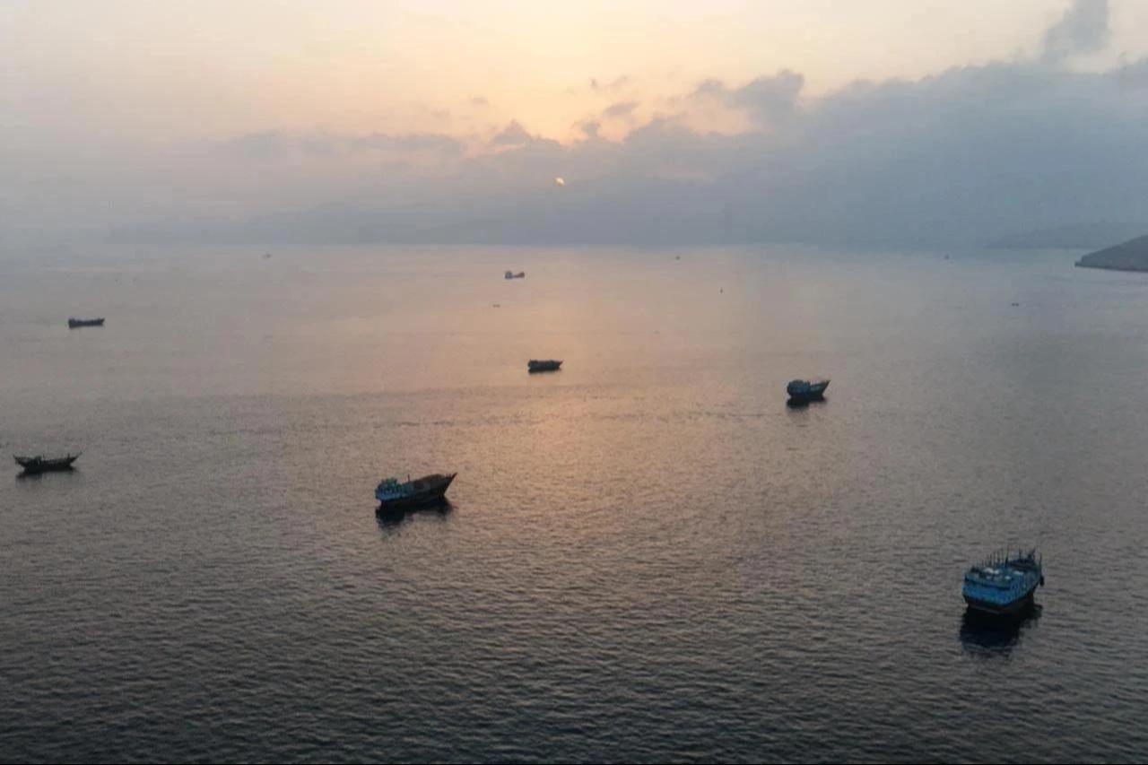 This aerial photograph shows boats anchored off Oman’s northern Musandam Peninsula near the Strait of Hormuz, June 27, 2026. (AFP Photo)