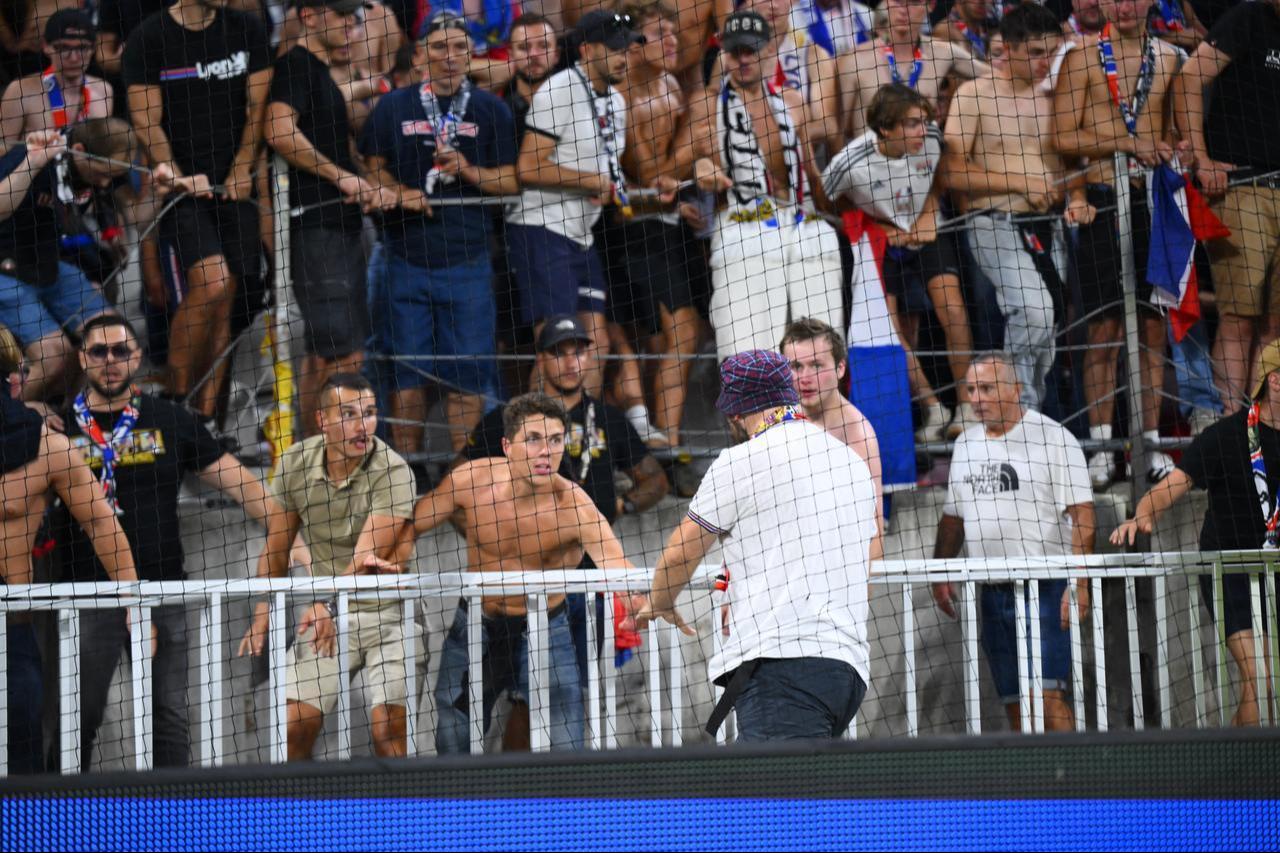 A scuffle breaks out between Olympique Lyon fans and security personnel during the UEFA Champions League playoff round second-leg match between Olympique Lyon and Fenerbahce at Groupama Stadium in Lyon, France, August 26, 2026. (AA Photo)