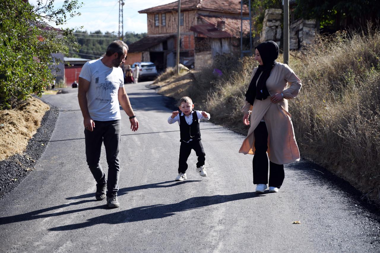 Asphalt road helps boy with walking disorder exercise in Kastamonu village