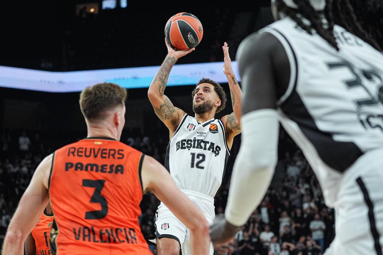 Scottie Wilbekin (12) of Besiktas competes against Nate Reuvers (3) of Valencia Basket during the EuroLeague Regular Season Round 1 match between Besiktas and Valencia Basket at the Turkcell Basketball Development Center in Istanbul, Türkiye, on September 25, 2026. (AA Photo)
