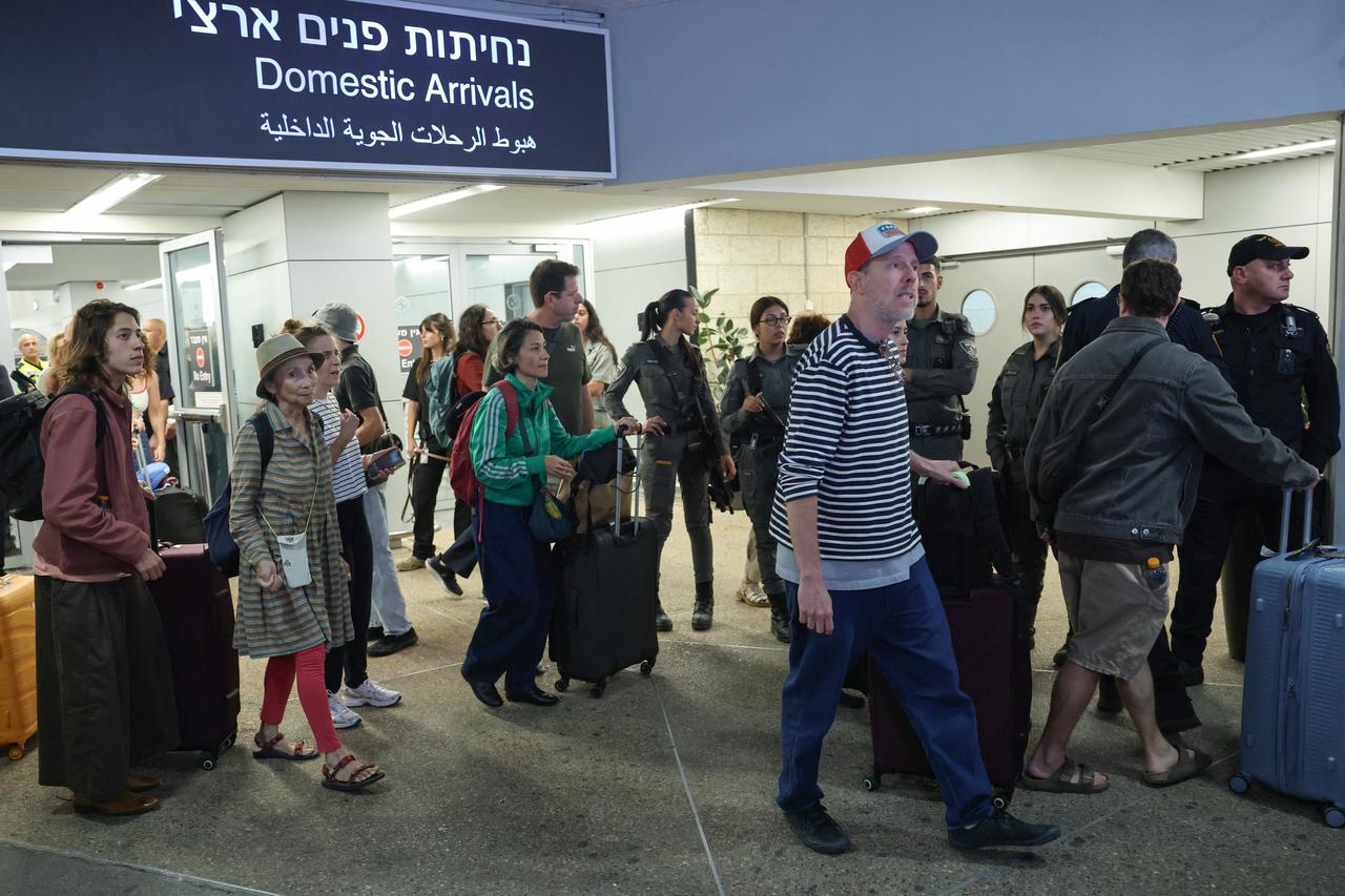 Passengers from an earlier diverted flydubai flight are seen after landing at Israel's Ben Gurion Airport in Lod on September 30, 2026. (AFP Photo)