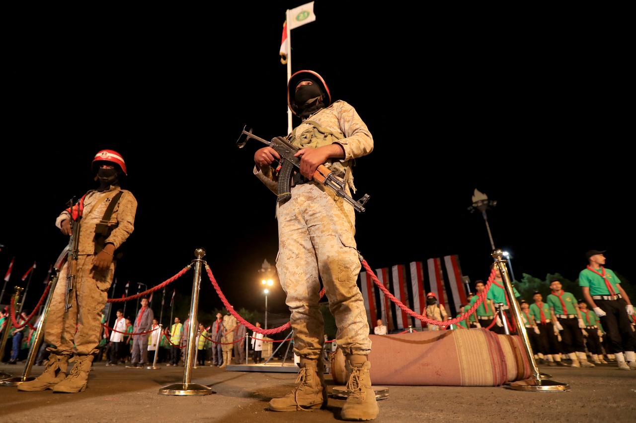 Security personnel stand guard during a ceremony organised by Houthis to mark the 12th anniversary of takeover of Yemeni capital, in Sanaa on September 20, 2026. (AFP Photo)
