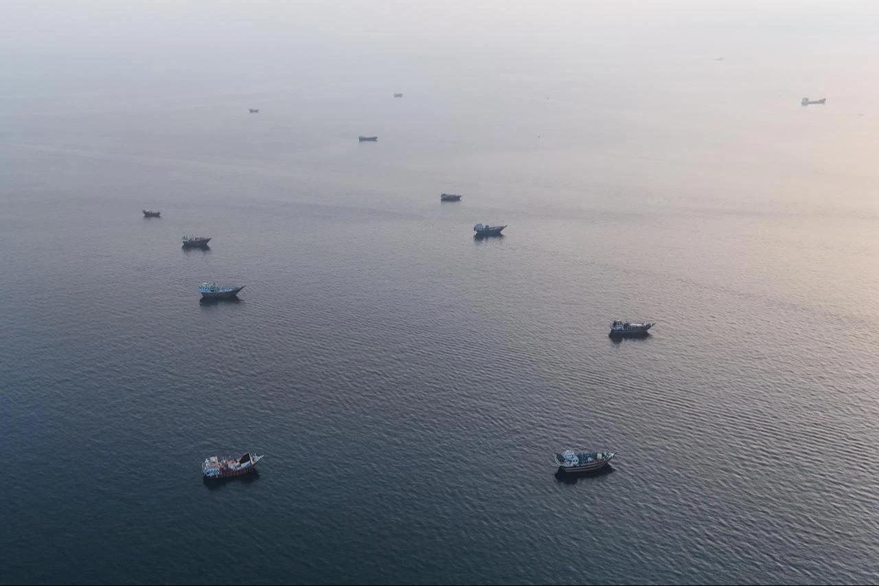This aerial photograph shows boats anchored off Oman’s northern Musandam Peninsula near the Strait of Hormuz on June 27, 2026. (AFP Photo)
