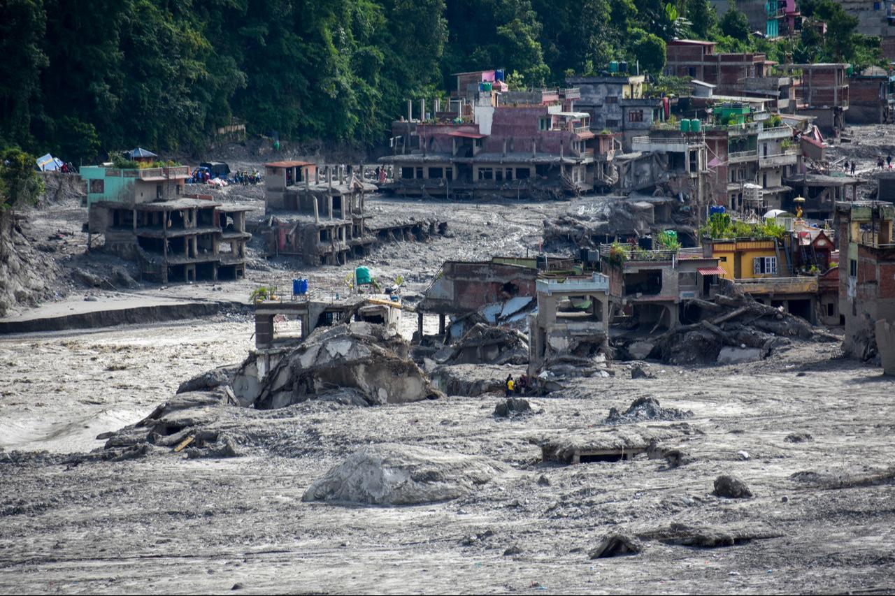 Flood-damaged buildings stand amid mud and debris after devastating flooding in Nuwakot, Nepal, Sept. 1, 2026. (AA Photo)