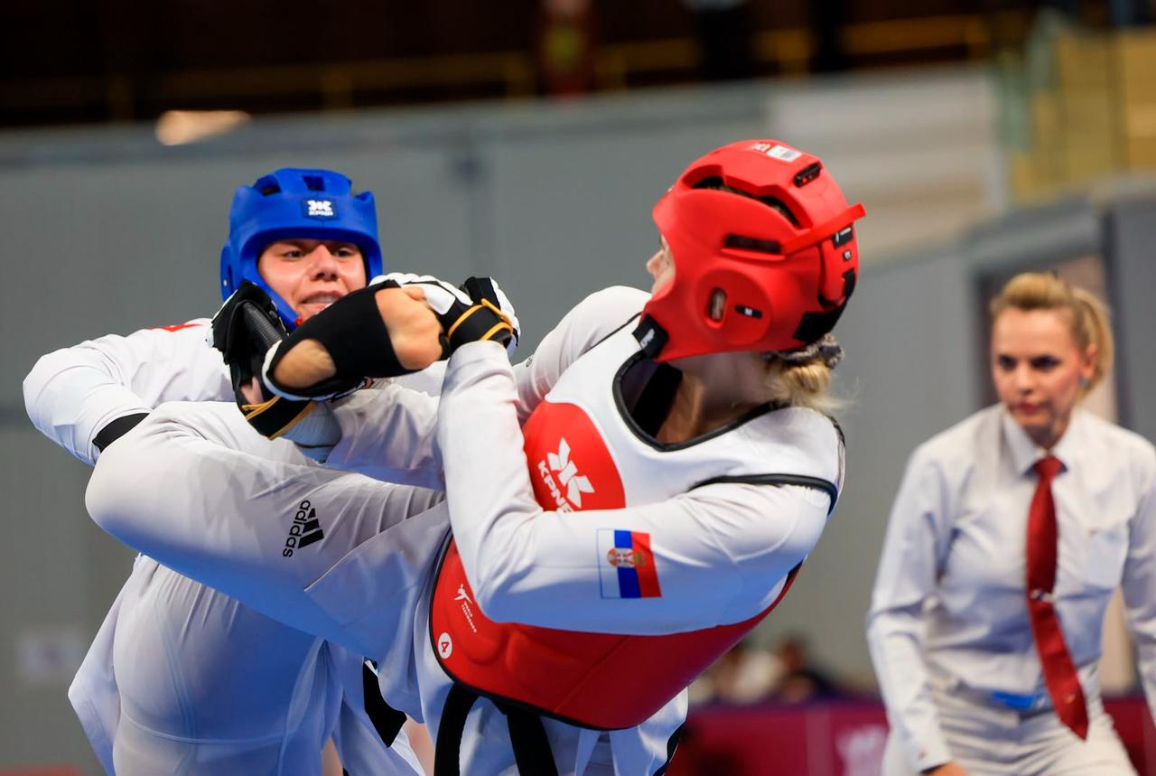 A Turkish taekwondo athlete competes against a Serbian opponent during the 20th Mediterranean Games in Taranto, Italy, Aug. 23, 2026. (AA Photo)