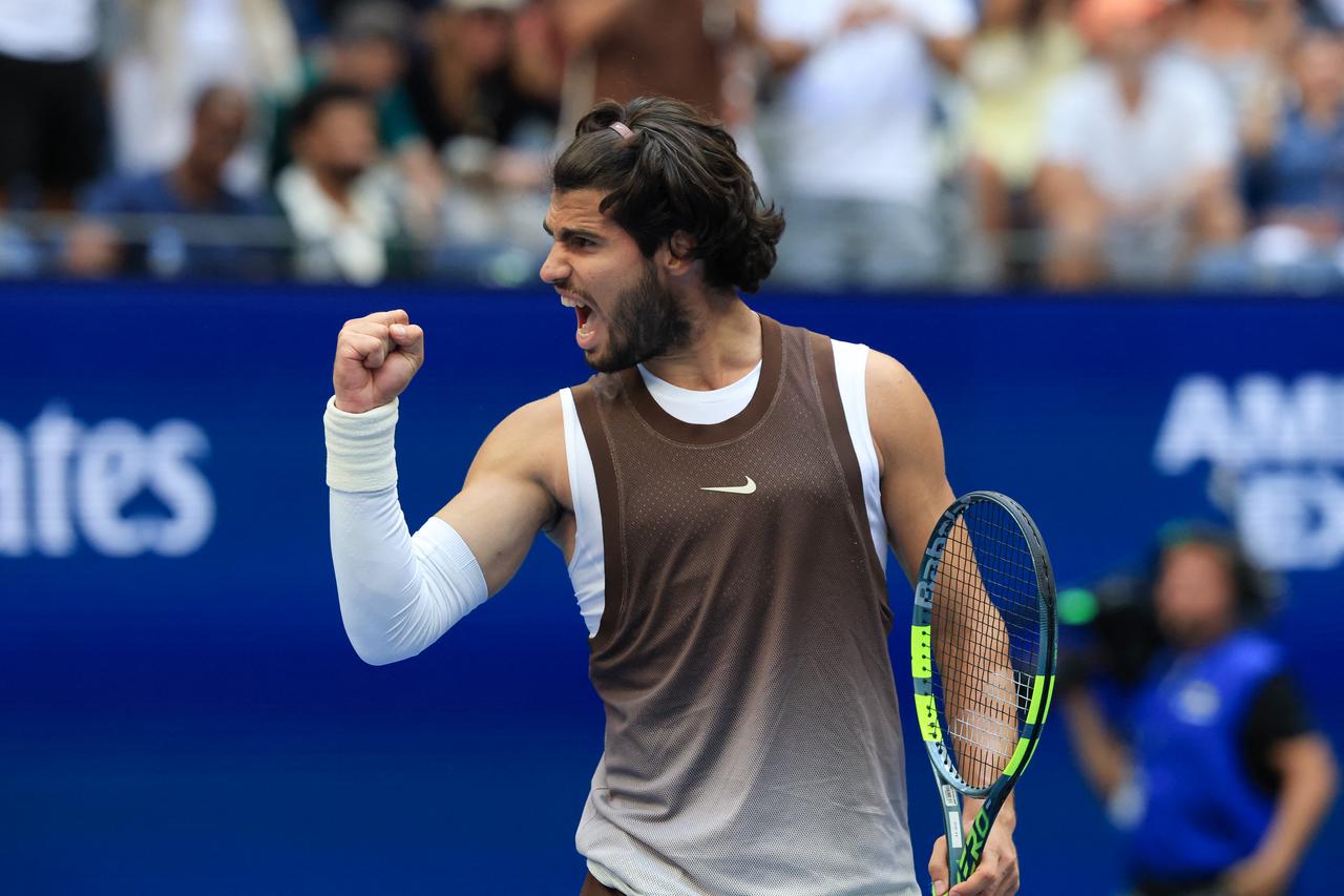 Spain's Carlos Alcaraz gestures to the crowd after defeating China's Wu Yibing at the US Open tennis tournament on September 4, 2026. (AFP Photo)