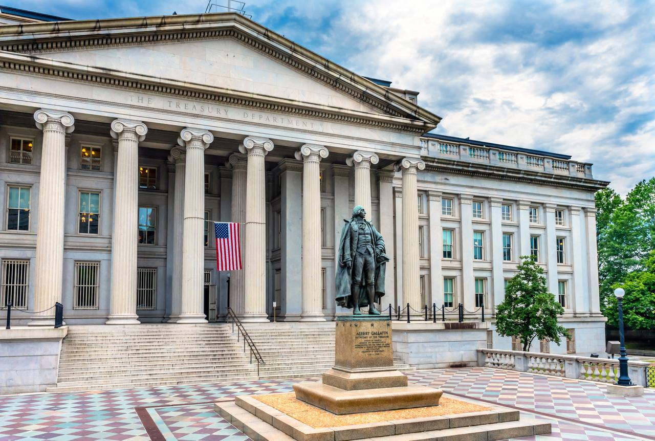 The U.S. Treasury Department building, with a statue of former Treasury Secretary Albert Gallatin in front, in Washington, D.C. (Adobe Stock Photo)