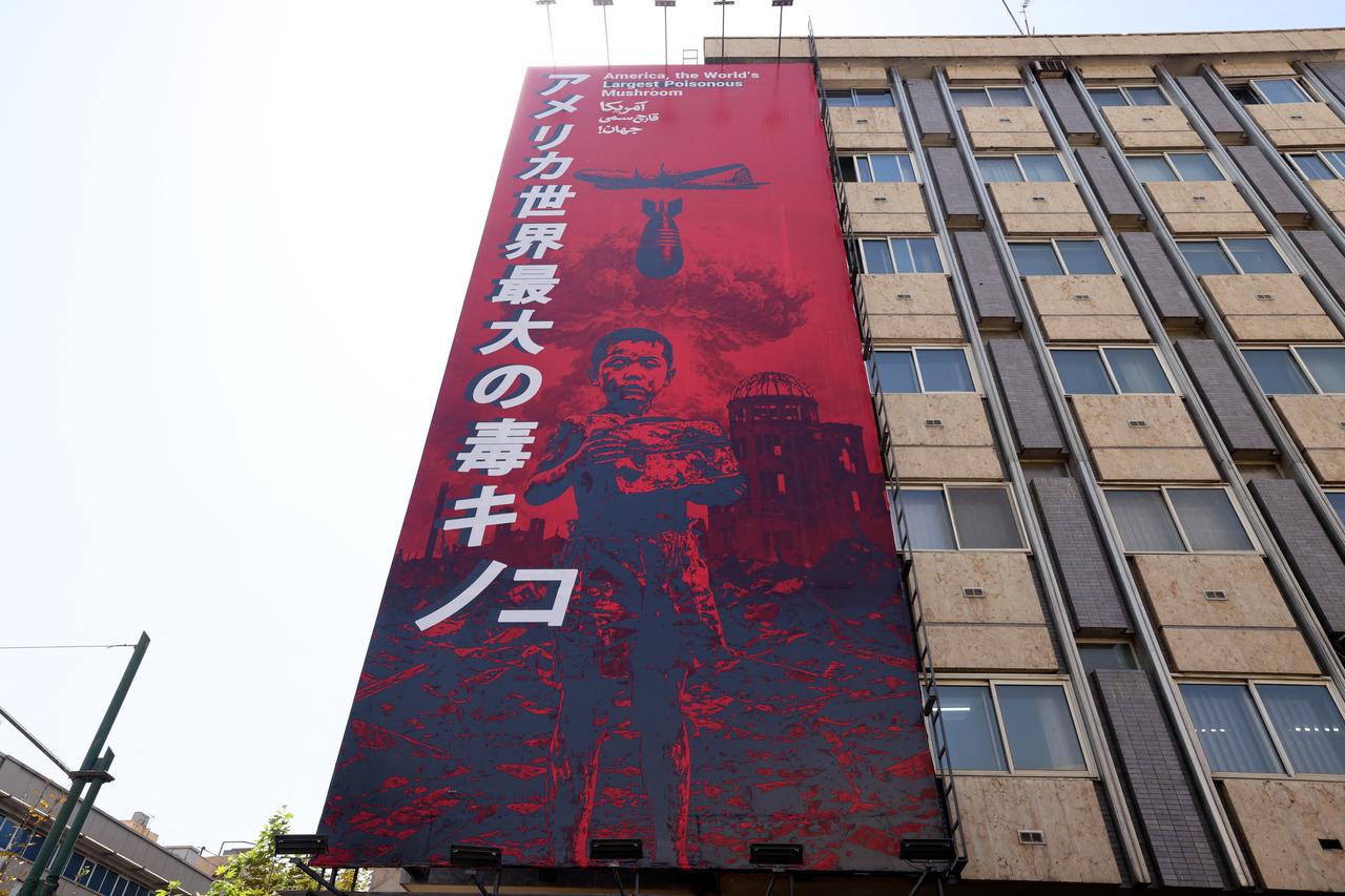A large anti-US banner with reference to the dropping of the atomic bomb on the Japanese city of Hiroshima, is seen on the facade of a building in Tehran on September 2, 2026. (AFP Photo)