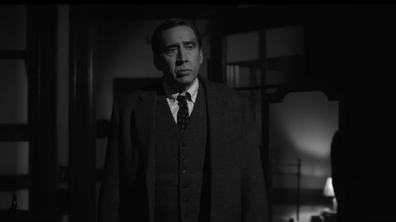A suited character appears in a dimly lit room in a black-and-white scene from the “Spider-Noir” trailer ahead of the series’ May 27 premiere on Prime Video. (Photo via Prime Video)
