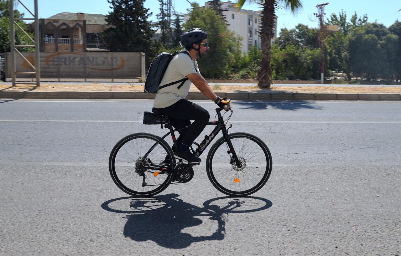 Family physician Selman Yasar cycling to his office. (AA Photo)