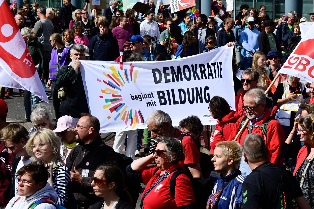Protesters hold a banner reading "Democracy starts with education" during a demonstration for an open society based on solidarity during a festival of democracy in Magdeburg, eastern Germany, on September 5, 2026. (AFP Photo)