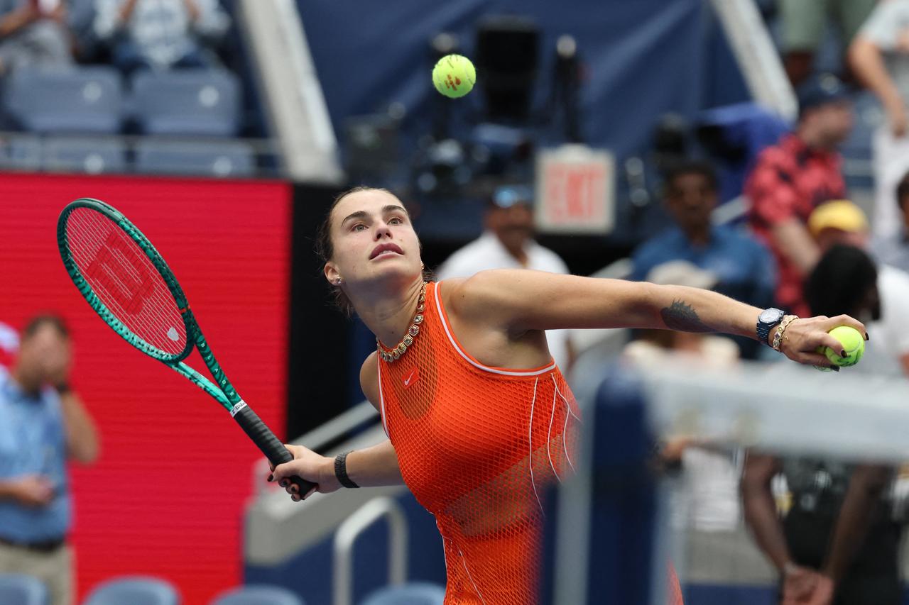 Belarus's Aryna Sabalenka throws tennis balls to the crowd after defeating U.S.'s Taylor Townsend. (AFP Photo)
