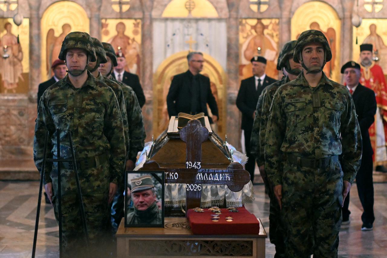 Serbian armed forces stand guard as Darko Mladic stands in front of the coffin of his father while taking part in a public memorial on the day of the funeral ceremony for war criminal Ratko Mladic at St Lukas church in Belgrade, on September 7, 2026. (AFP Photo)