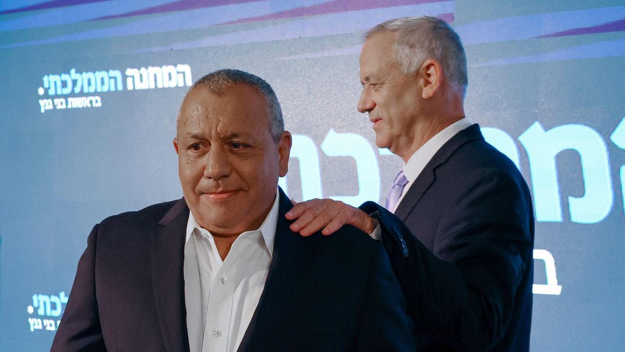 Israel's former army chief of staff Gadi Eisenkot (L) and then-Defense Minister and Kahol Lavan (Blue and White) party chief Benny Gantz arrive for a joint press conference in the central city of Ramat Gan, August 14, 2022. (AFP Photo)