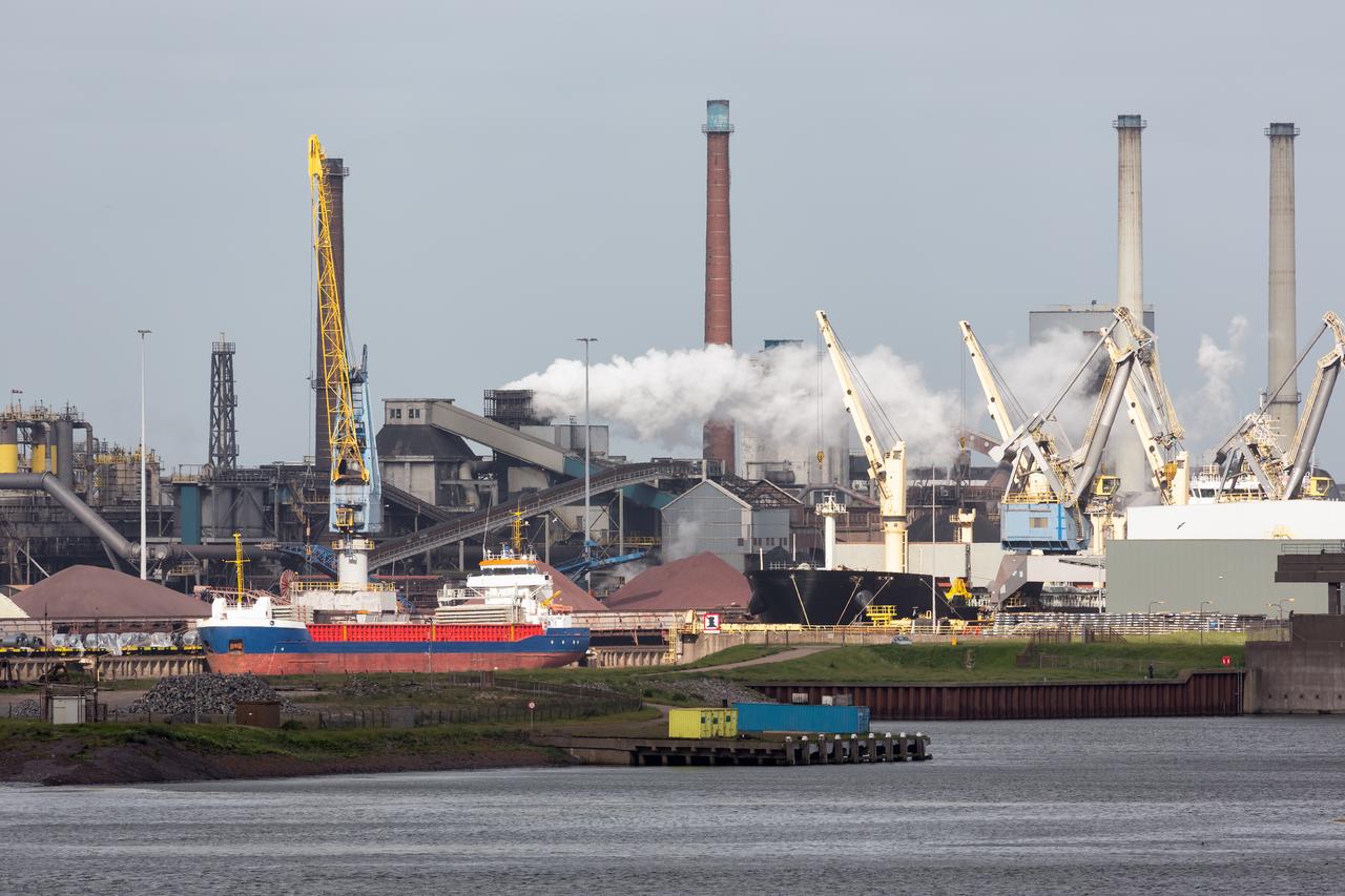 Steelworks and cargo ships are seen at the industrial harbor of IJmuiden, Netherlands. (Adobe Stock Photo)