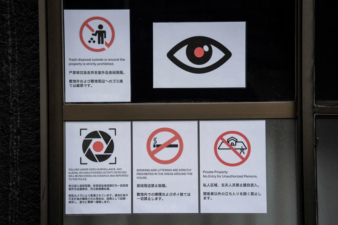 Notices warning against littering, smoking, and unauthorized entry near Shinjuku Station in Tokyo on September 7, 2026. (AFP Photo)