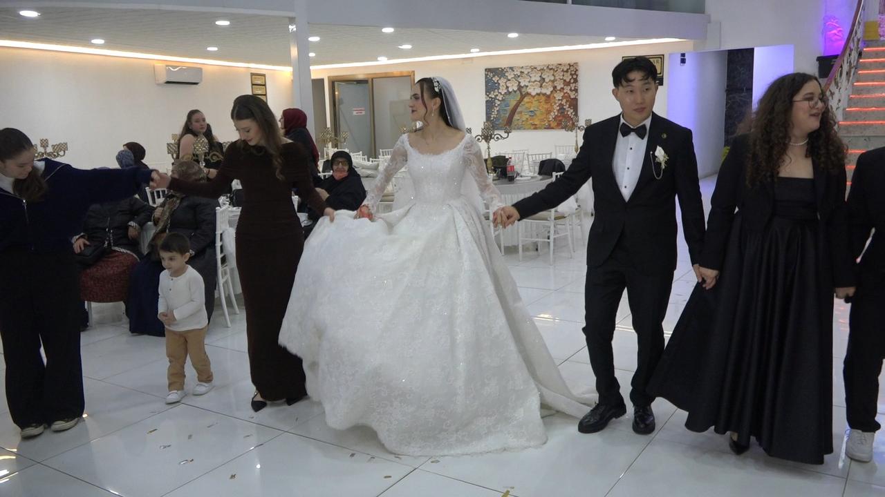 South Korean national Yeong Jun joins a traditional wedding celebration with his Turkish bride, Melisa Sat, in Rize, Türkiye, Jan. 11, 2026. (IHA Photo)