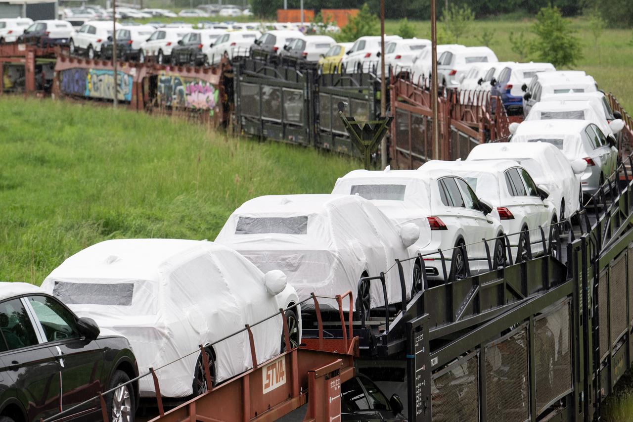 Cars of the Volkswagen (VW) group are transported by rail on the compound at production site of the German carmaker in Emden, northern Germany, on May 20, 2022. (AFP File Photo)