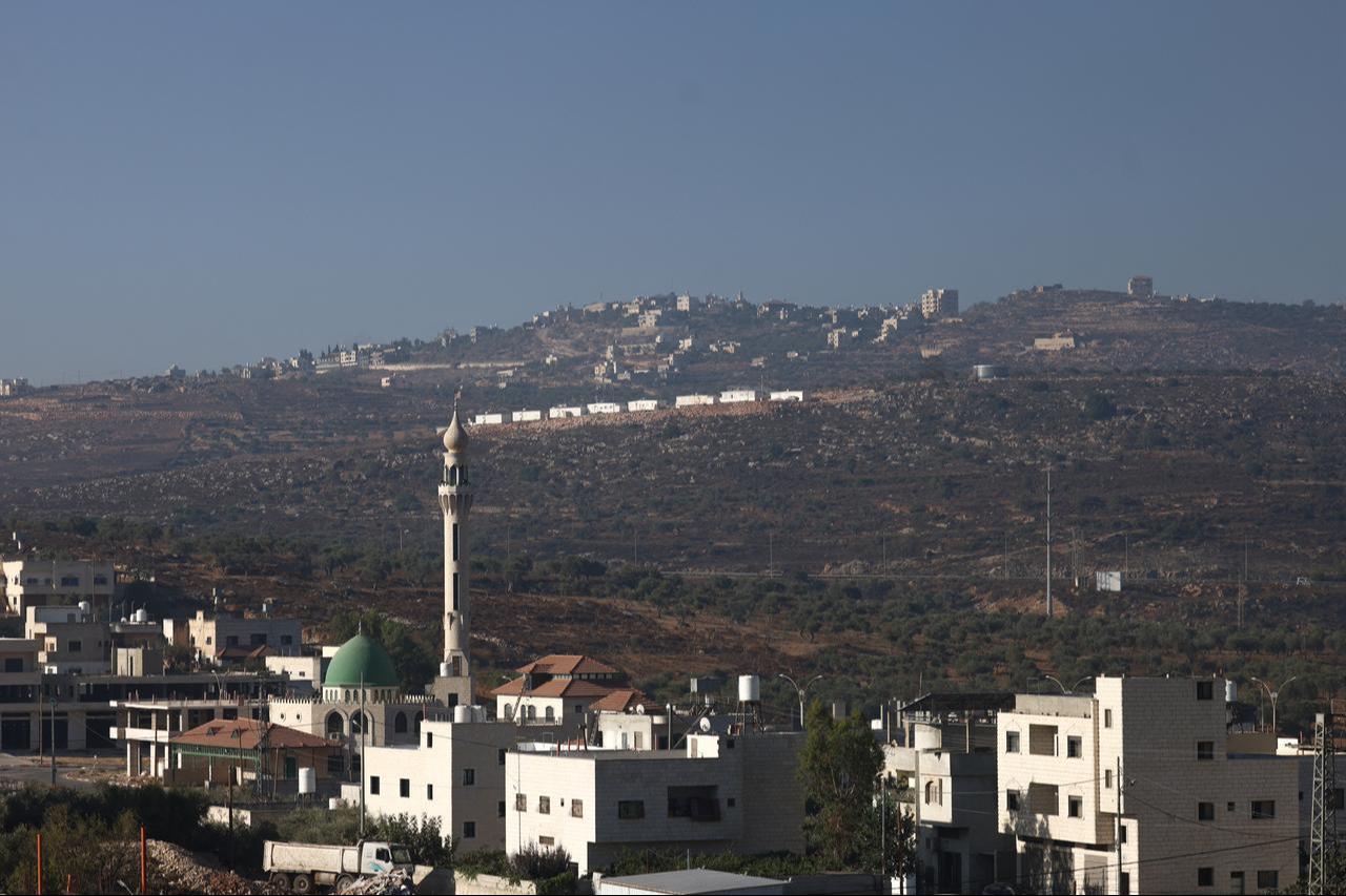 An image taken from the Israeli-occupied West Bank village of Aqraba shows the new illegal Israeli outpost being built, south of the West Bank city of Nablus, Sept. 8, 2026. (AFP Photo)