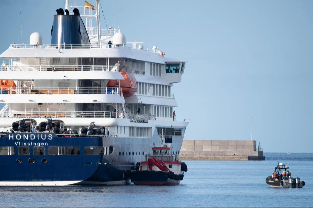 Boats approach the Dutch flagged hantavirus-stricken cruise ship MV Hondius after it arrived at the industrial port of Granadilla de Abona on the island of Tenerife in Spain's Canary Islands on May 10, 2026. (AFP Photo)