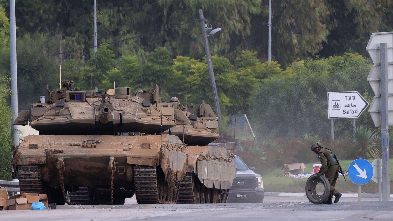 Israeli army Merkava tanks are positioned near the border with Gaza in southern Israel on October 10, 2023. (AFP Photo)