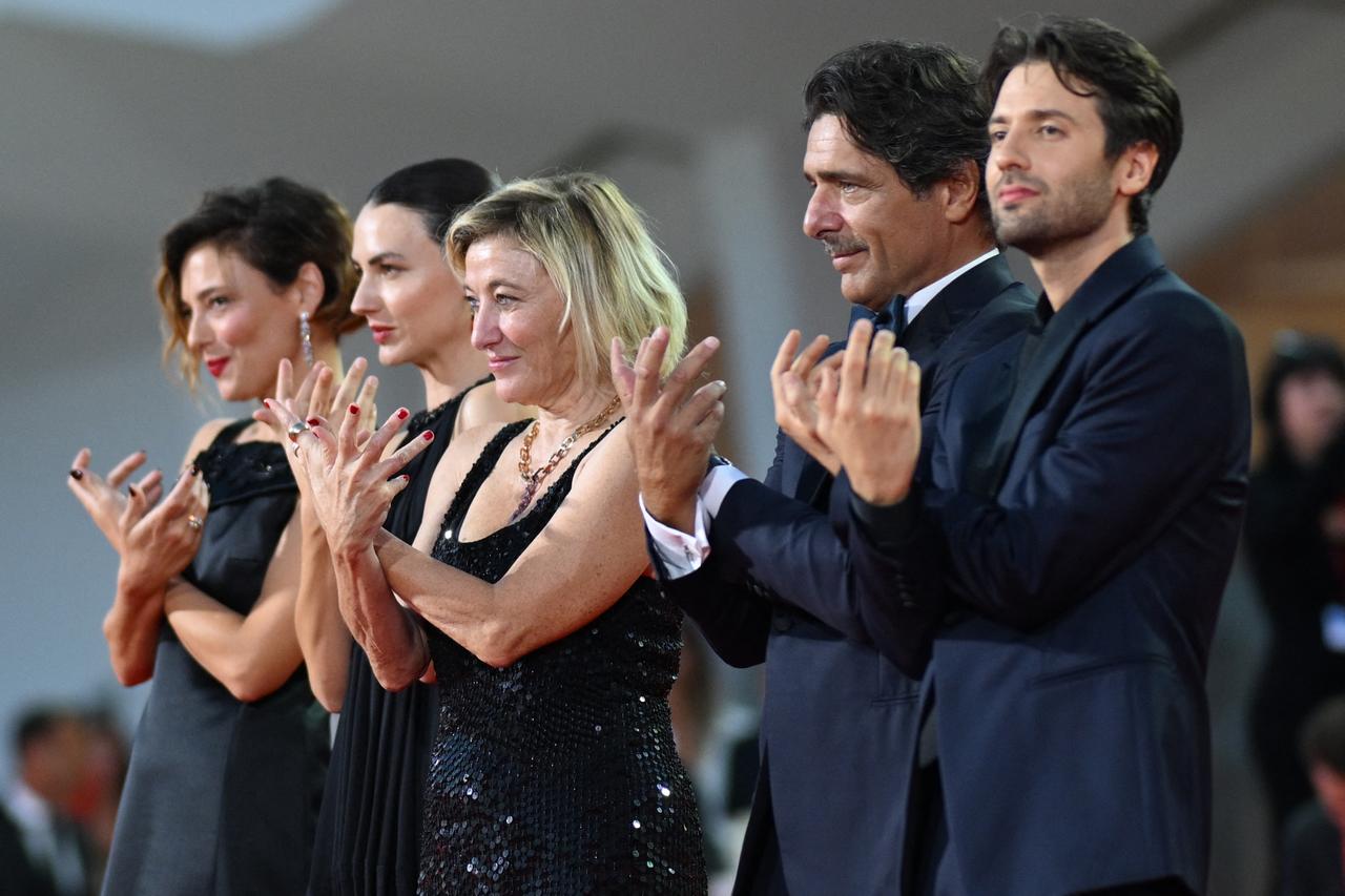 Cast and crew of L’Estranea applaud during the film’s red carpet at the 83rd Venice International Film Festival in Venice, Italy, Sept. 7, 2026. (AFP Photo)