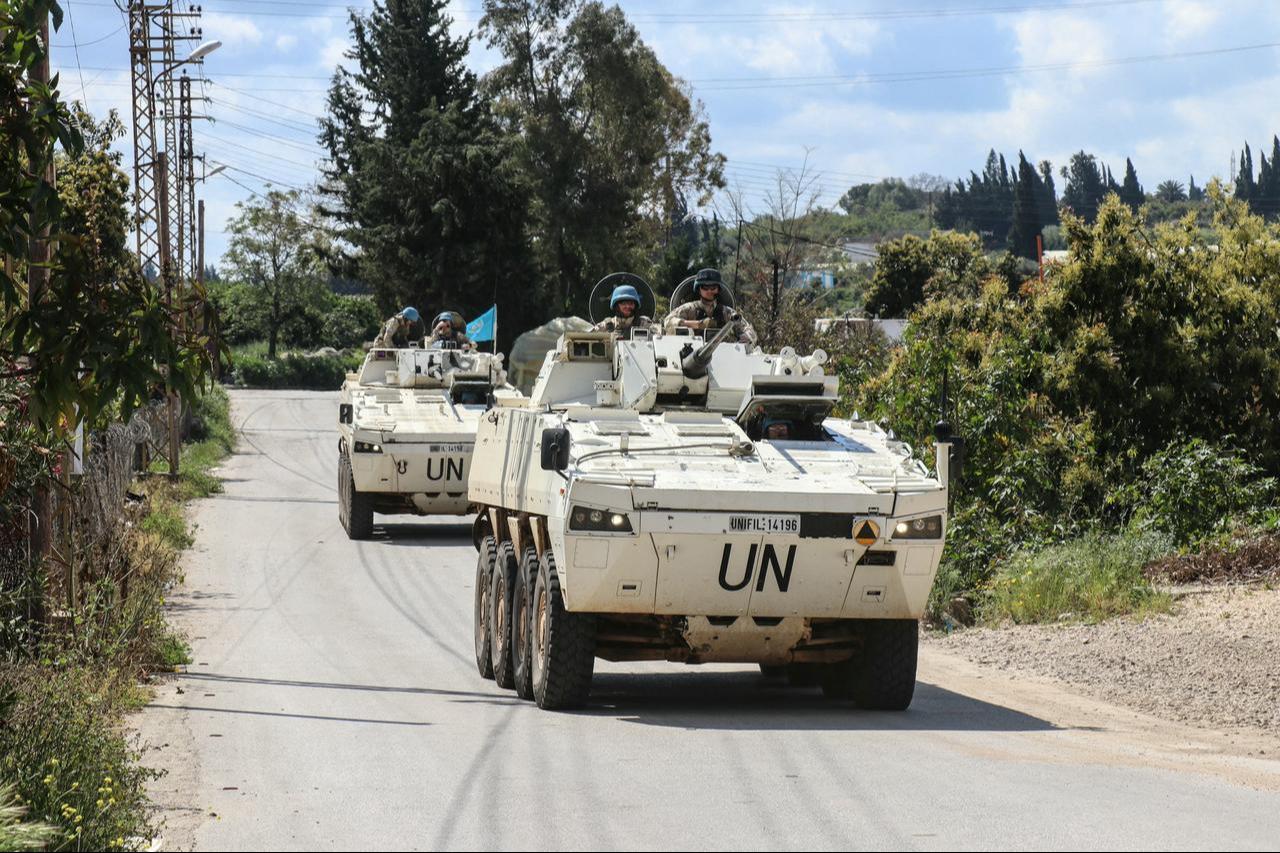Members of the UN peacekeeping force in Lebanon (UNIFIL), in armored vehicles, patrol the road of the southern Lebanese village of Tair Debba on April 12, 2026. (AFP Photo)