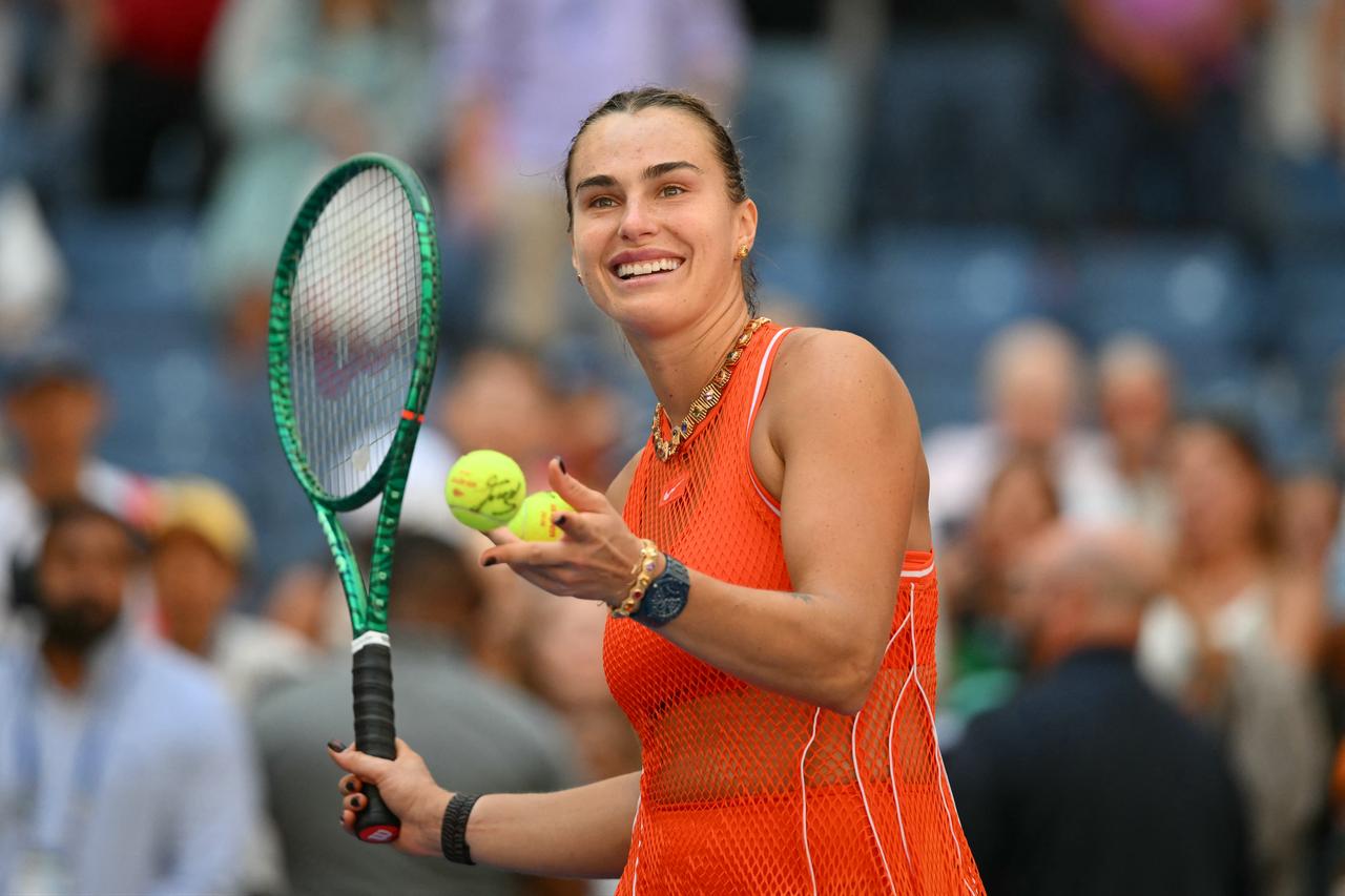 Belarus's Aryna Sabalenka hits balls to the crowd after defeating Czech Republic's Linda Noskova in their women's singles quarter-final tennis match on day ten of the US Open tennis tournament at the USTA Billie Jean King National Tennis Center in New York on September 8, 2026. (AFP Photo)