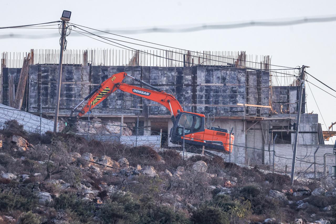 An Israeli bulldozer works near the illegal Israeli settlement of Migdalim, close to the Palestinian village of Qusra, south of the city of Nablus in the Israeli-occupied West Bank, on September 6, 2026. (AFP Photo)