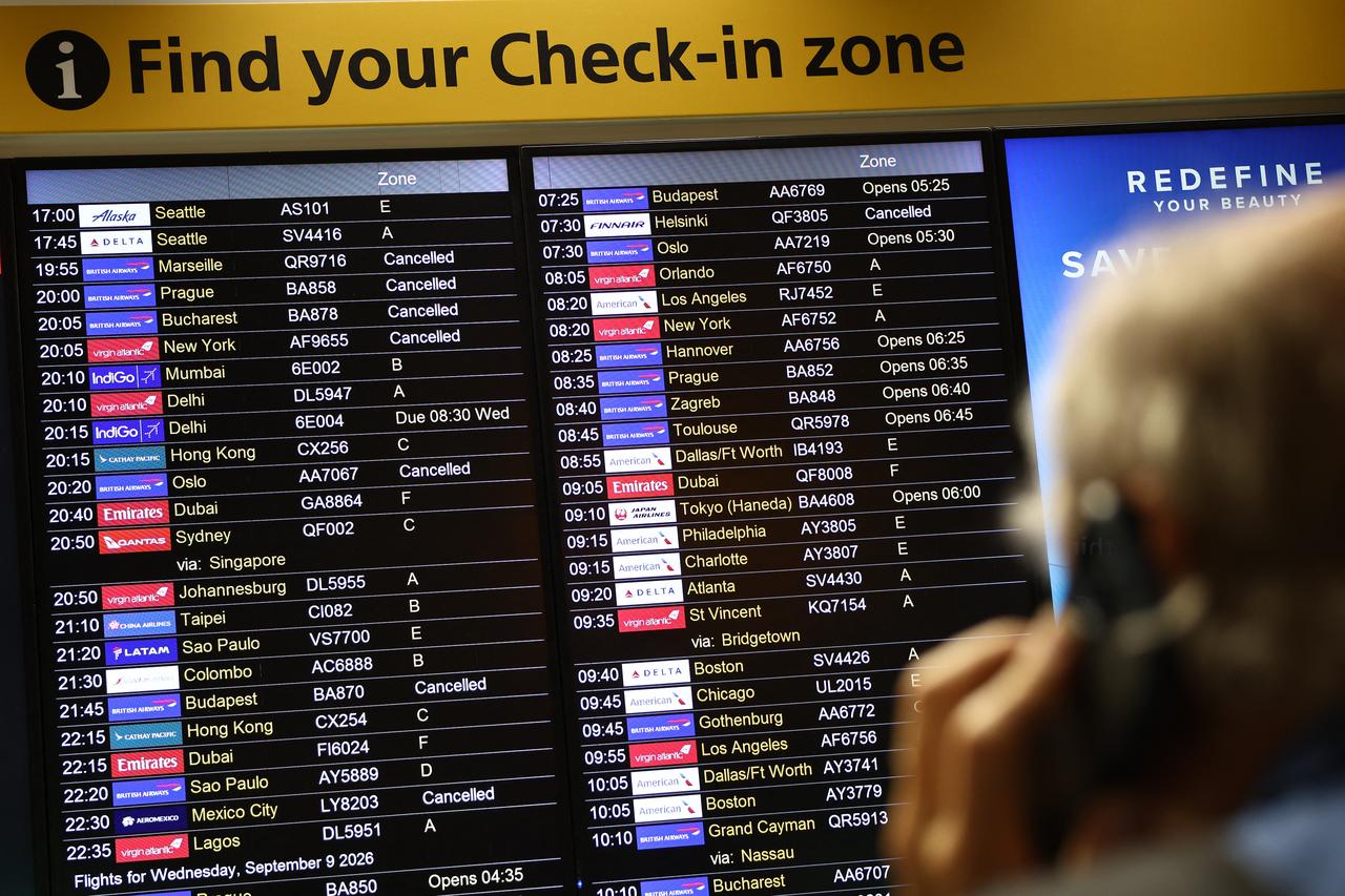 Cancelled flights are displayed on an electronic check-in board at Terminal 3 of London Heathrow Airport, west of London, on September 8, 2026. (AFP Photo)