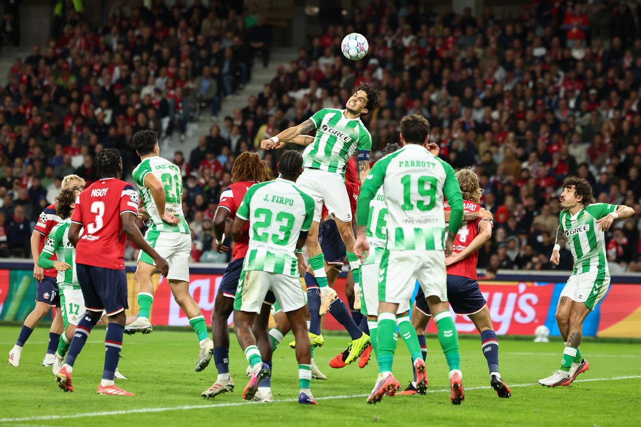 Real Betis' Spanish defender #05 Marc Bartra (C) heads the ball during the UEFA Champions League, league phase day 1, football match between Lille (FRA) and Real Betis (ESP) at the Stade Pierre Mauroy, in Villeneuve d'Ascq, on September 8, 2026. (AFP Photo)